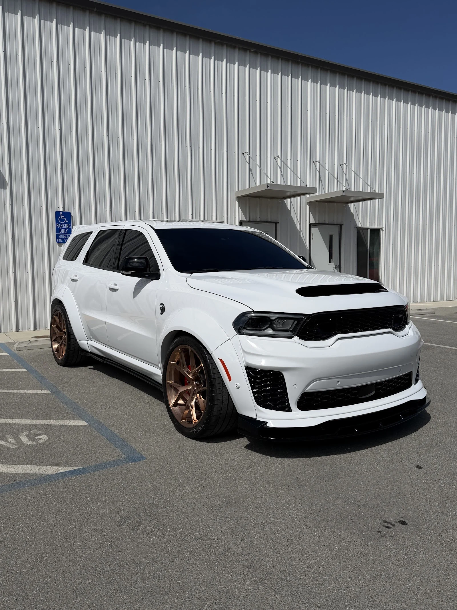 Dodge Durango SRT came in for some wet sanding and paint correction. Touchup on raw chips. Finished off with a ceramic coating. — Optimized Detailing owner Google photo